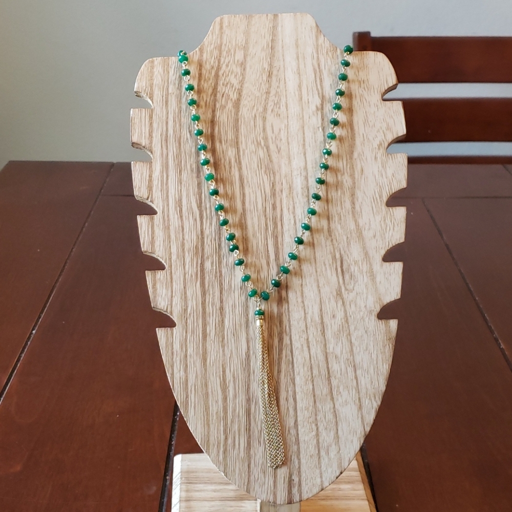 Sequin beaded necklace with gold tone tass…
